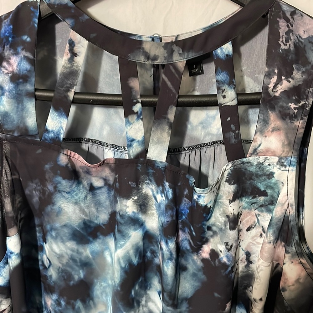 A torrid size 1X tie-dye, peekaboo blouse